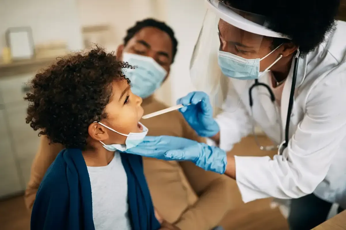 Dentist treating a child patient's tooth at the Dentist LTD clinic in Nakuru