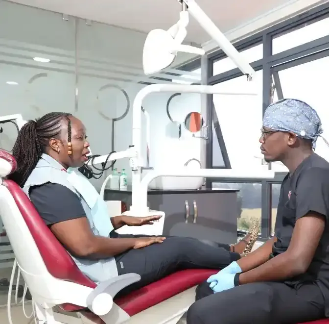 A dental patient explaining to a dentist at The Dentist ltd in Nakuru